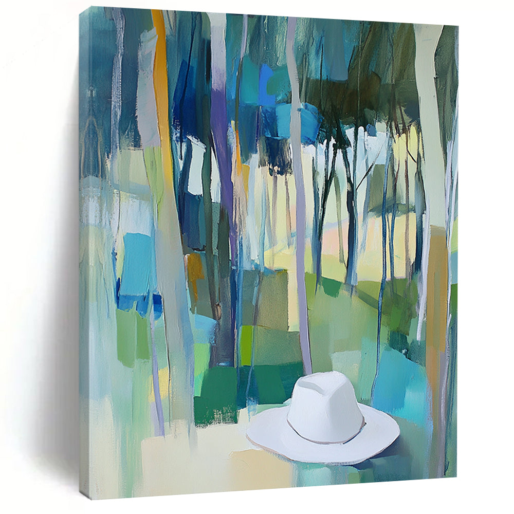 Contemporary abstract painting featuring trees in vibrant blue, green, and yellow hues with a white hat resting on the ground. DLZ0897