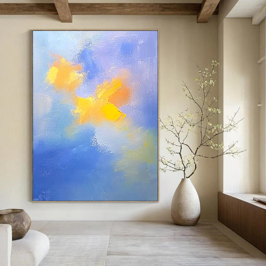 Contemporary abstract painting featuring soft blue and yellow clouds with gentle oil strokes on canvas, inspired by the style of Cuno Amiet. DLZ0354