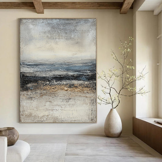 Contemporary hand-painted abstract art featuring textured layers of gray and blue with warm gold accents and a misty horizon evoking mystery and solitude. DLZ0656