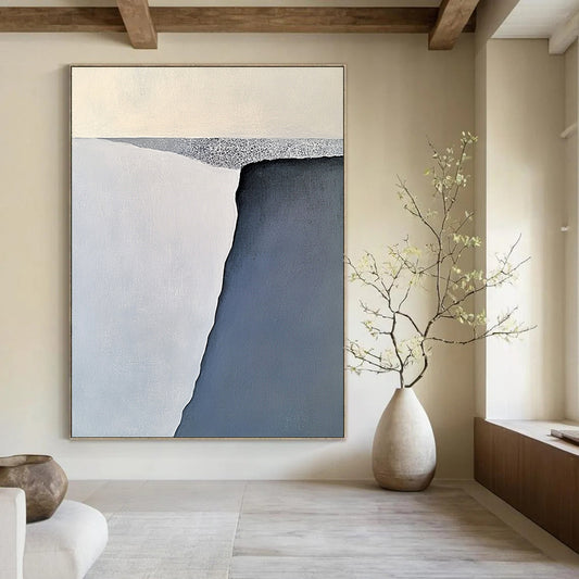Contemporary large abstract painting features serene gray-blue and white iceberg forms with soft brushstrokes balanced on a flat gray base. DLZ1006