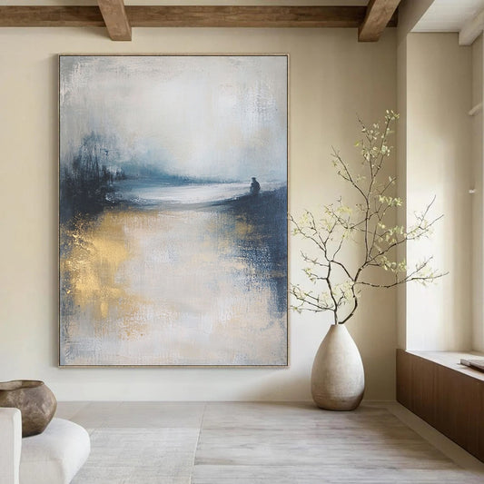 Contemporary abstract art featuring a moody ocean landscape in soft focus, neutral tones enhanced by gold and blue, creating a serene atmosphere. DLZ0464