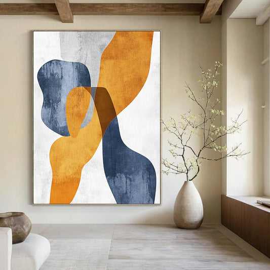 Contemporary hand-painted abstract art featuring organic shapes in mustard yellow and bluish-grey with touches of burnt orange on textured paper. DLZ0501