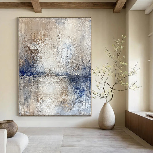 Contemporary hand-painted abstract artwork depicting a serene lake and sky with textured beige tones and vibrant blue accents for a striking visual experience. DLZ0471
