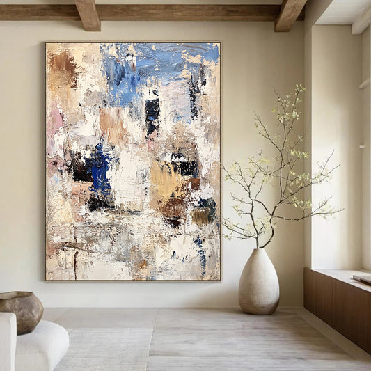Contemporary abstract artwork showcasing textured white rocks and buildings with bold brushstrokes in beige, brown, blue, and gray. DLZ0898