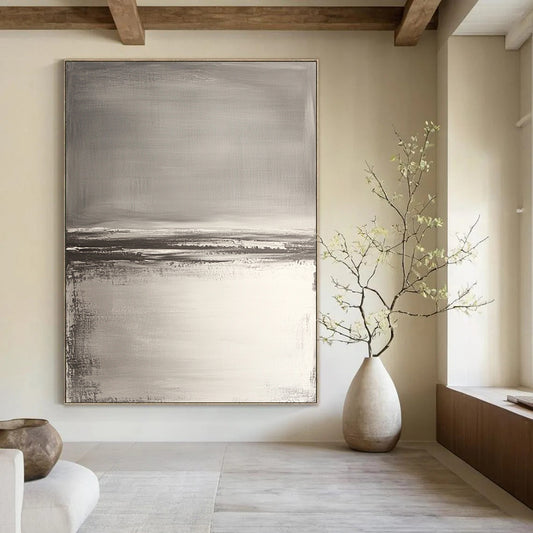 Contemporary hand-painted abstract artwork features neutral tones with gray and white, textured water reflections, and soft brush strokes for a serene beach landscape. DLZ0390