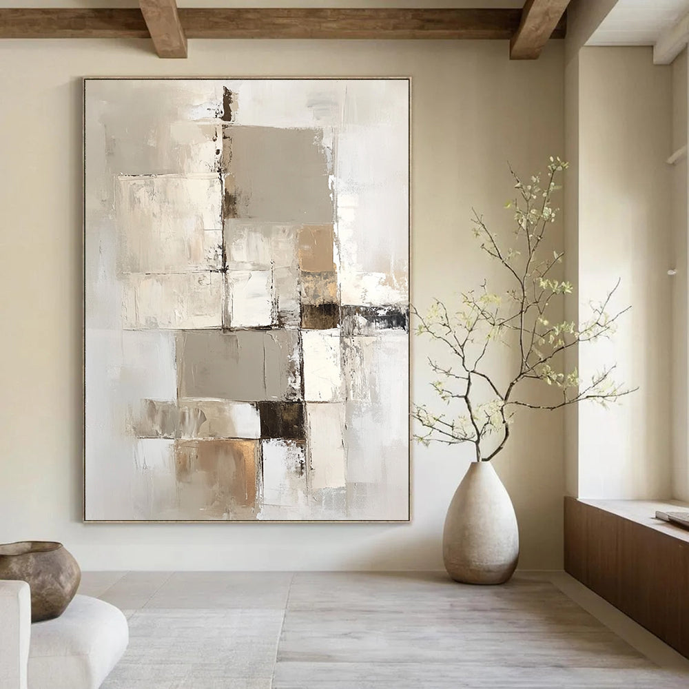 Large contemporary abstract painting with a beige and white palette showcasing geometric shapes and textures on a vertical canvas. DLZ0697