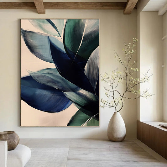 Large contemporary abstract painting featuring vibrant leaves in dark blue and green tones on a beige background with soft edges and layered forms. DLZ0625