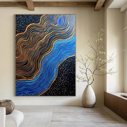 Contemporary hand-painted abstraction featuring blue and gold contrasts with gilded lines over a dark blue river in a black sand desert. DLZ1561