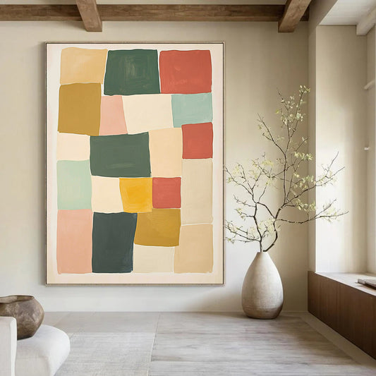 Contemporary hand-painted abstract artwork features geometric blocks in shades of green red and yellow against a beige background creating a harmonious composition. DLZ1596
