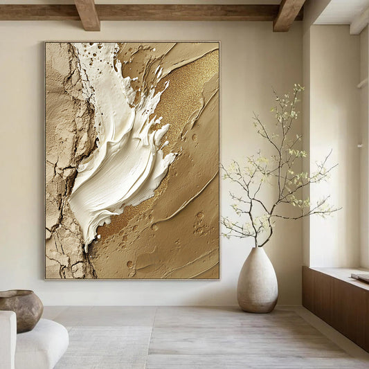 Contemporary hand-painted abstract art featuring a central white paint stroke adorned with gold glitter accents on a rugged stone-like background. DLZ1195