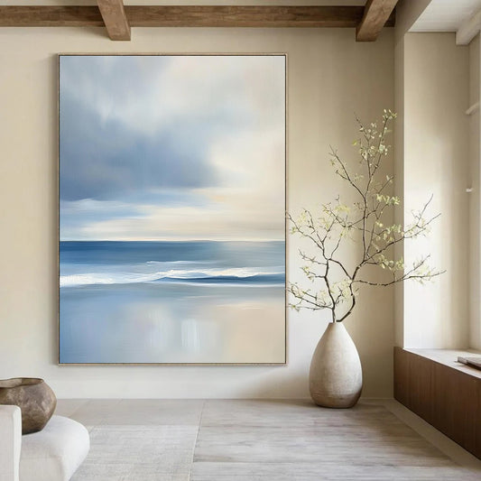 Contemporary abstract artwork features a serene ocean with gentle waves and soft clouds, showcasing light blues and grey tones for a tranquil ambiance. DLZ1460