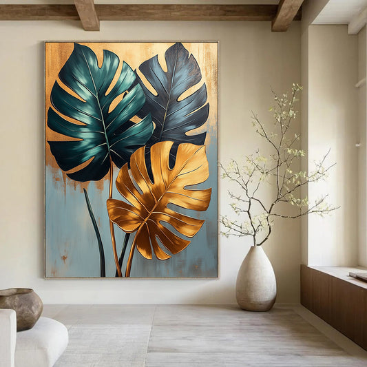 Contemporary abstract painting featuring lush monstera leaves in green and gold on a soothing light blue backdrop with elegant gold accents. DLZ1680