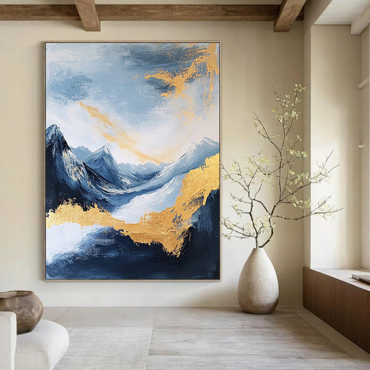 Large contemporary abstract painting featuring exquisite details of mountains clouds and sea in deep gold indigo and yellow colors against a white background DLZ0338