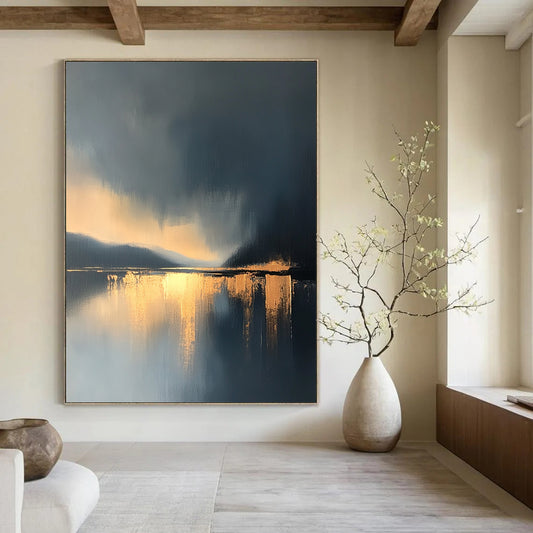 Large contemporary abstract painting features a lake and sky with golden light reflections and atmospheric clouds in minimalist modern art style. DLZ0470