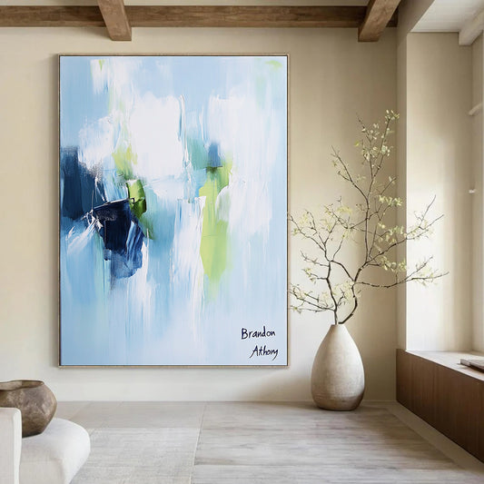 Contemporary hand-painted abstract artwork in light blue, white, and green tones creates a serene and peaceful atmosphere with elegant brush strokes. DLZ1045