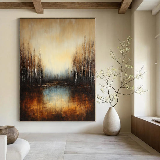 Large contemporary abstract painting featuring a deep brown and grey gradient with earthy orange hues and reflective water surrounded by soft blue trees. DLZ1294