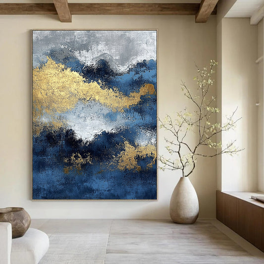 Contemporary abstract painting featuring blue and gold textures with ocean waves and dark silver clouds creating depth and mystery. DLZ0341