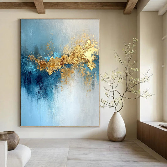 Contemporary hand-painted abstract artwork featuring gold leaf, soft light, blue tones, atmospheric clouds, and a mysterious shimmering texture. DLZ0336