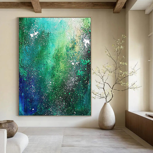 Contemporary hand-painted abstract artwork featuring emerald green and blue, depicting the Milky Way with textured white star speckles and dark teal foliage. DLZ0347