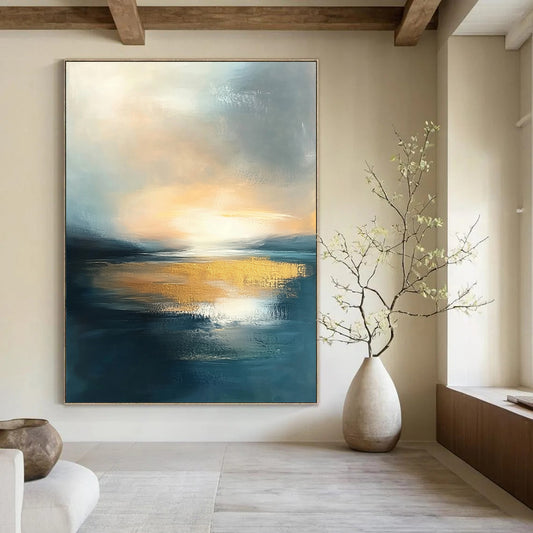 Contemporary abstract painting featuring water and sky at sunset with muted tones and gold accents, perfect for elevating any space. DLZ0494