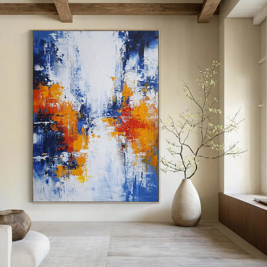Large modern hand-painted abstract artwork featuring blue white and orange hues with broad brush strokes and thick impasto layers depicting an urban Parisian landscape. DLZ0732