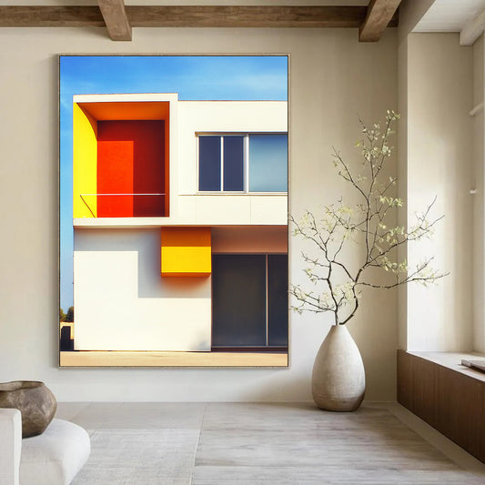 Contemporary abstract art featuring a minimalist white structure with vivid orange and yellow accents set against a clear blue sky background. DLZ1640