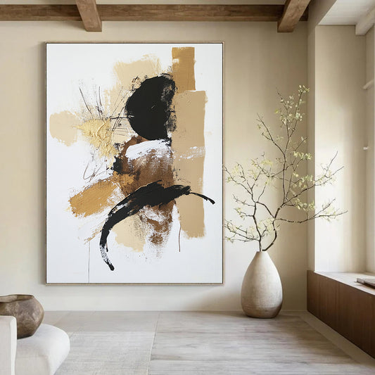 Contemporary abstract painting features a white background with a beige and black palette accented in gold utilizing dry brush technique and textured strokes. DLZ0432