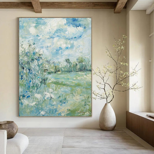 Contemporary hand-painted abstract art featuring soft clouds over serene trees and grass with a calming color palette of blue green and beige. DLZ1473