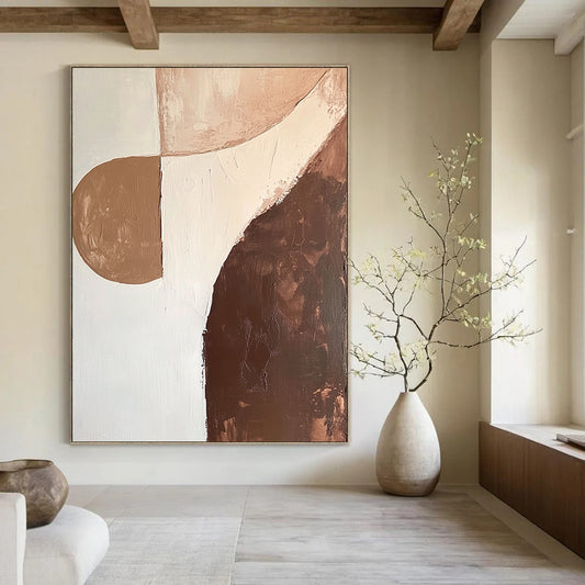 Contemporary abstract artwork featuring organic shapes in brown and white with soft edges and minimalist design, emphasizing fluid lines and canvas texture. DLZ0997
