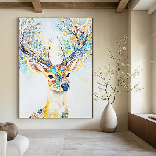 Abstract contemporary artwork features a majestic deer adorned with floral antlers in light blue and yellow tones set against a dreamy white canvas. DLZ1245