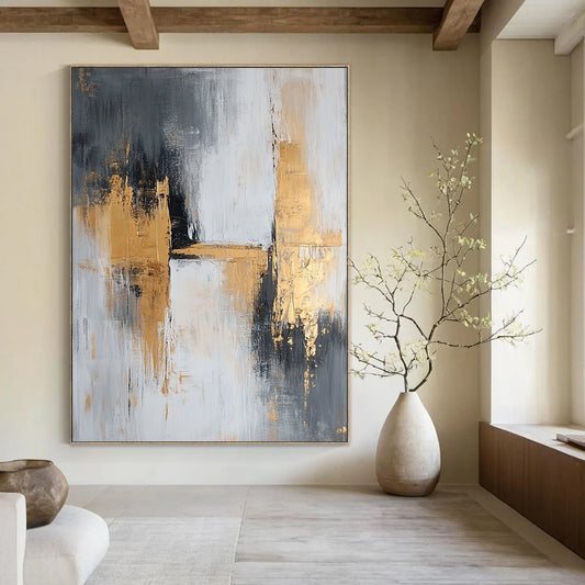 Large contemporary abstract painting featuring gray and gold tones with textured brush strokes that evoke calmness and tranquility on a spacious canvas. DLZ0709
