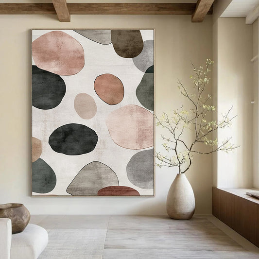 Contemporary hand-painted abstract artwork features a serene design of overlapping circles and pebbles in shades of gray with brown green and pink accents. DLZ1646
