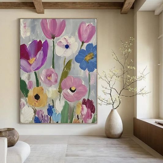 Large contemporary abstract painting featuring vibrant daisies and tulips in pink purple blue green and yellow against a soft gray backdrop with visible brush strokes. DLZ1262