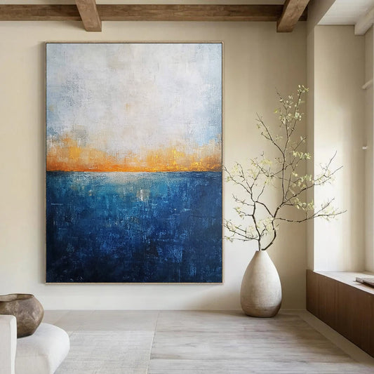 Contemporary abstract artwork featuring a deep blue ocean textured canvas with misty horizon neutral colors and elegant gold highlights. DLZ0468