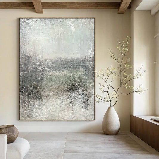 Large contemporary abstract painting featuring soft gray and subtle green hues, textured canvas evokes tranquility and nostalgia in a serene landscape. DLZ0871