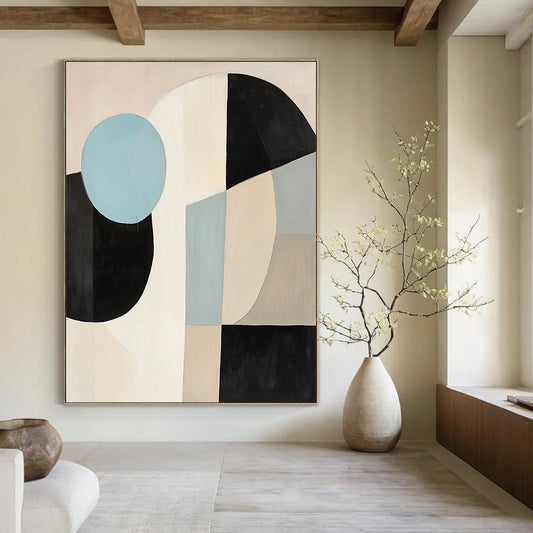 Contemporary abstract painting featuring large black white and beige shapes with a blue circle on a light pink background in soft minimalist style. DLZ1040
