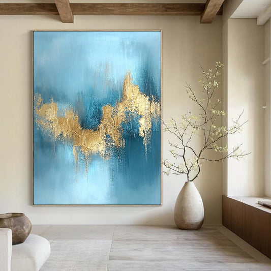 Contemporary hand-painted abstract art featuring a serene water and sky blue backdrop adorned with stunning gold foil textures. DLZ0723