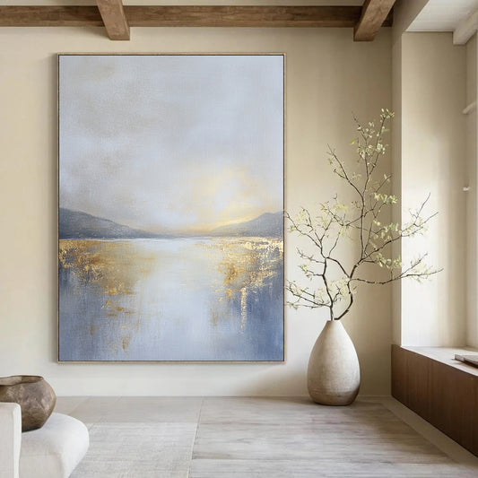 Contemporary abstract painting featuring an overcast sky in gold and grey tones with a tranquil lake in the distance, creating a serene atmosphere. DLZ0585