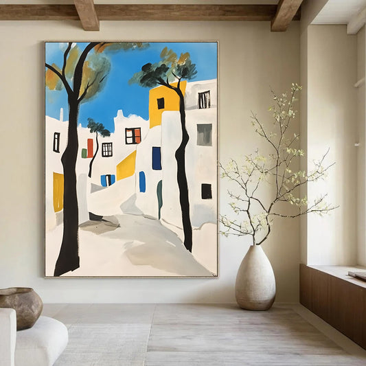 Contemporary hand-painted abstract art featuring Mykonos white buildings with black outlines minimalistic shapes and vibrant blue trees against a crisp white background. DLZ1383