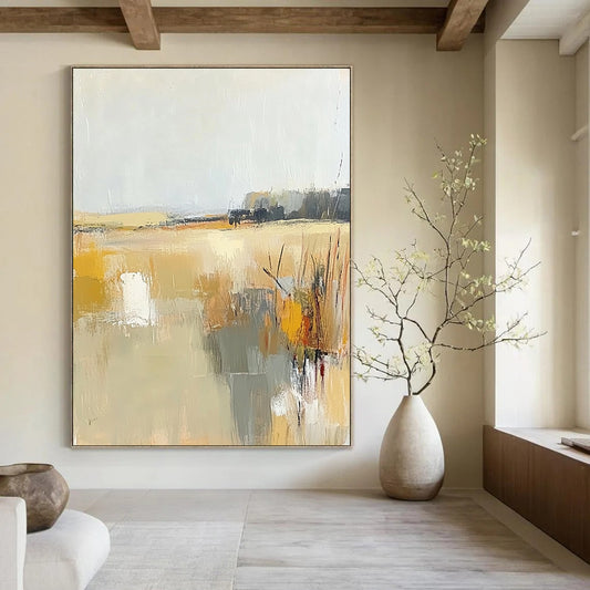 Contemporary abstract painting showcasing soft beige and gray tones with touches of yellow, illustrating the tranquil essence of a field beneath a light sky. DLZ0416