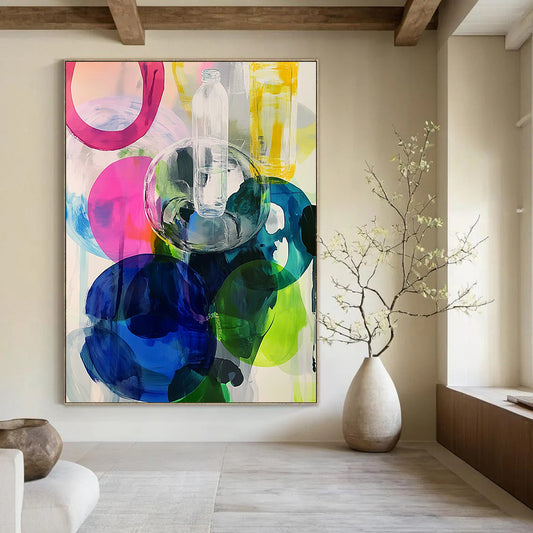 Contemporary abstract artwork featuring large round shapes in vibrant pinks blues greens and yellows enhanced with transparent plastic bottles. DLZ0984