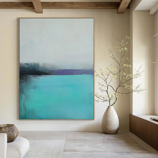 Large contemporary hand-painted abstract artwork captures a tranquil turquoise sea with a misty gray sky using muted colors and soft brush strokes for emotional depth. DLZ0428