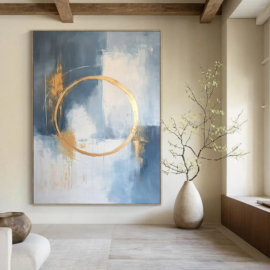 Large contemporary abstract painting features a light blue and white background with gold accents and elegant lines for a high-end aesthetic. DLZ0545