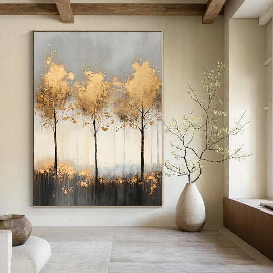 Contemporary abstract painting features misty landscape with light gray and gold tones, delicate tree shapes, and shimmering golden foil accents for a serene ambiance. DLZ1352