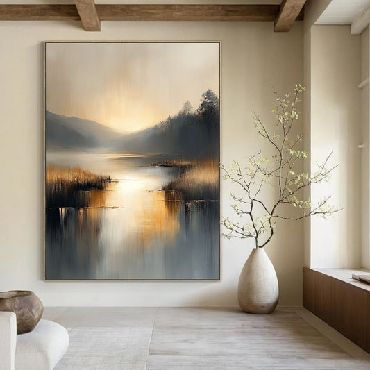 Contemporary abstract painting with soft gray and beige tones reflecting on water evokes serenity in a large canvas illuminated by golden hour light. DLZ0417