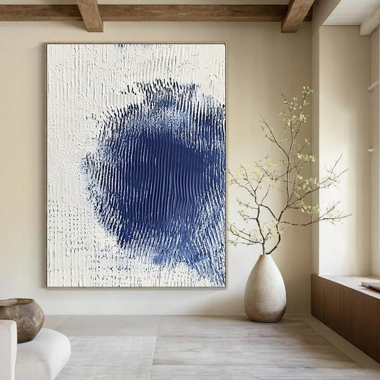 Contemporary abstract art featuring serene white and blue textures with a central dark blue spot creating depth and minimalistic elegance. DLZ1223