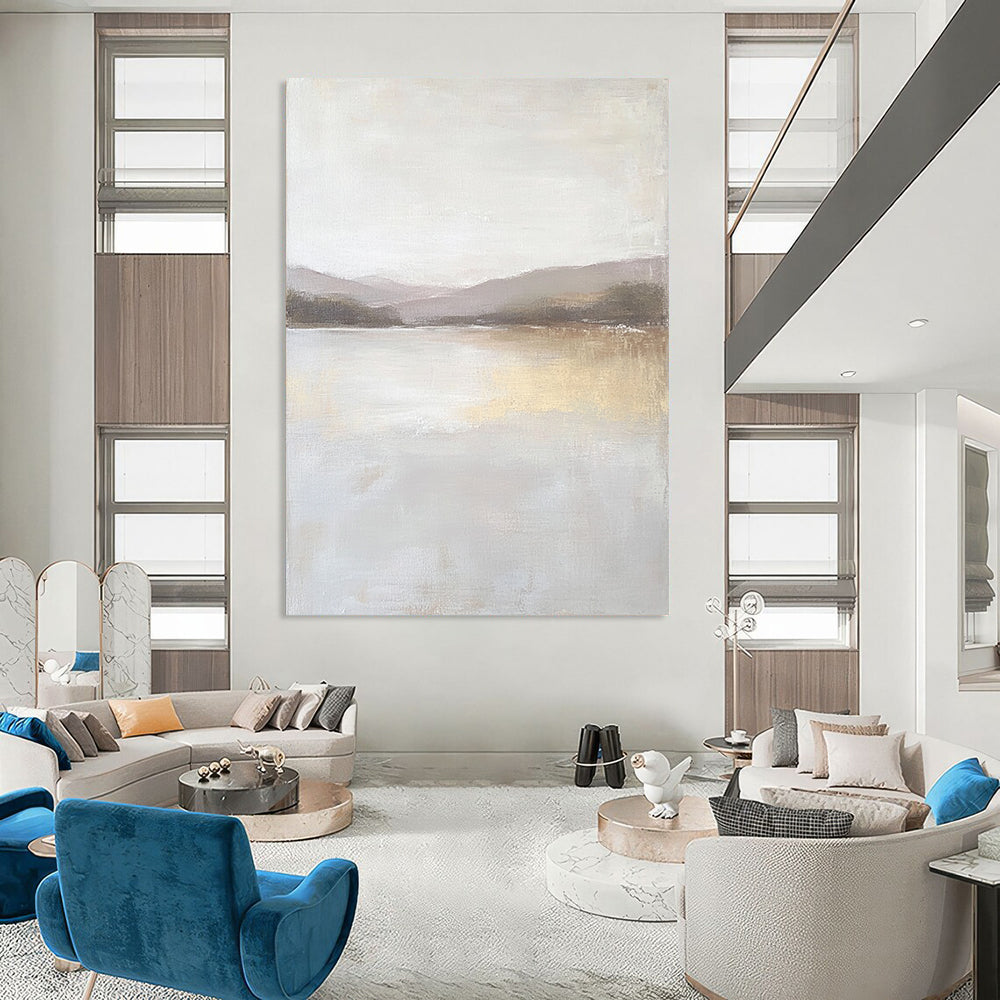 Contemporary abstract painting featuring a large lake in muted beige and gray tones with textured canvas and distant hills in the background. DLZ0415