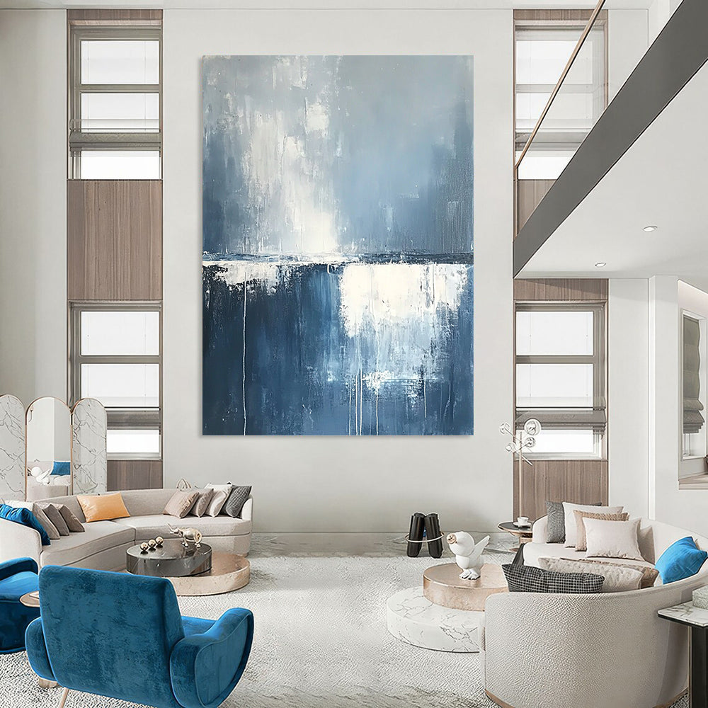 Contemporary hand-painted abstract art featuring misty clouds and rain over the ocean in soothing blue and grey tones with soft white edges. DLZ0630