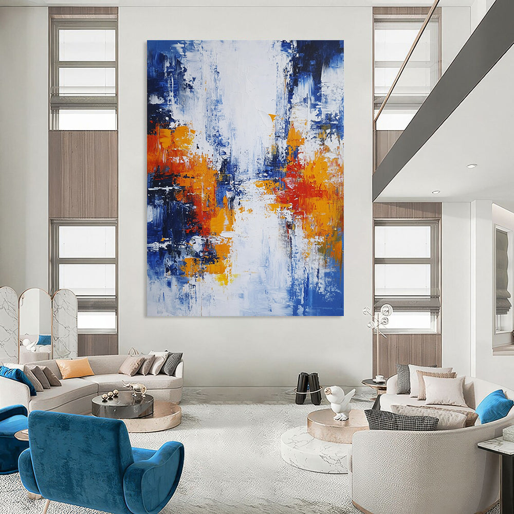 Large modern hand-painted abstract artwork featuring blue white and orange hues with broad brush strokes and thick impasto layers depicting an urban Parisian landscape. DLZ0732