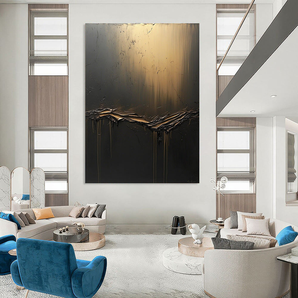 Large contemporary hand-painted abstract artwork features textured dark gray canvas with golden light and flowing black fluid, accented by ethereal shapes. DLZ0691
